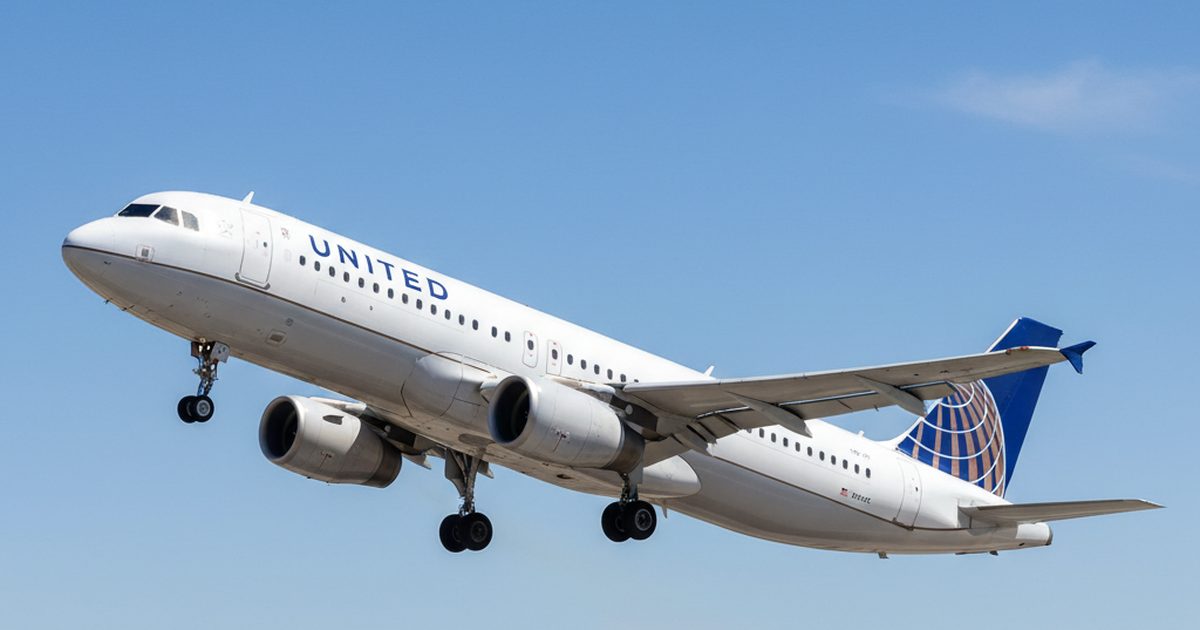 United A321neo lands at Dulles with blown-tire indication; rubber debris dented left flap over Virginia